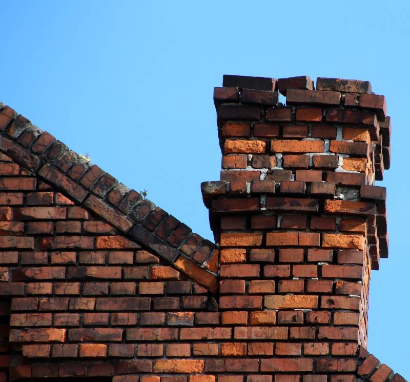 Damaged chimney on an Villa Park home showing cracks and missing mortar